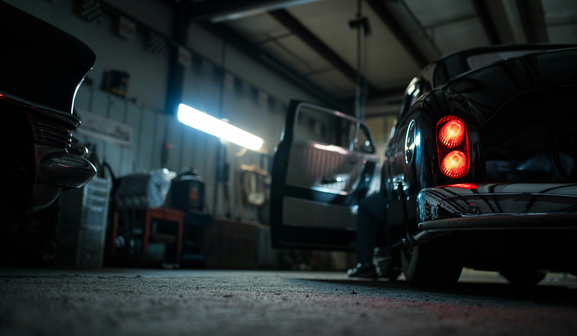 Car interior dimly lit in workshop